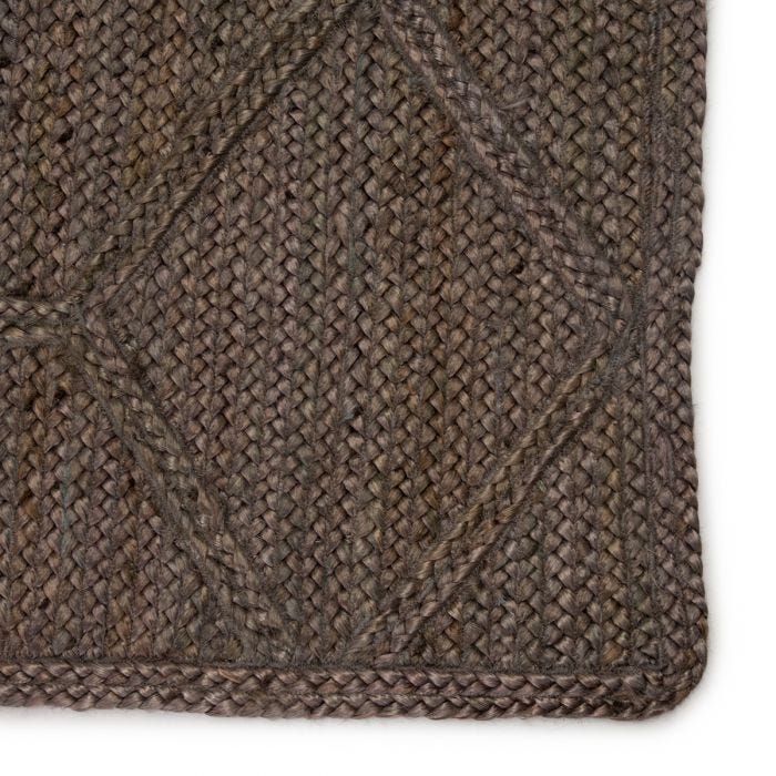 The Naturals Tobago collection delivers rich texture and organic allure to contemporary homes. Handwoven of jute, the Ponce area rug showcases a chic geometric trellis design. The mix of gray, taupe, and brown hues lend a deep natural tone to ground any space.  Handwoven  100% Jute  NAT42 Naturals Tobago Ponce Rug