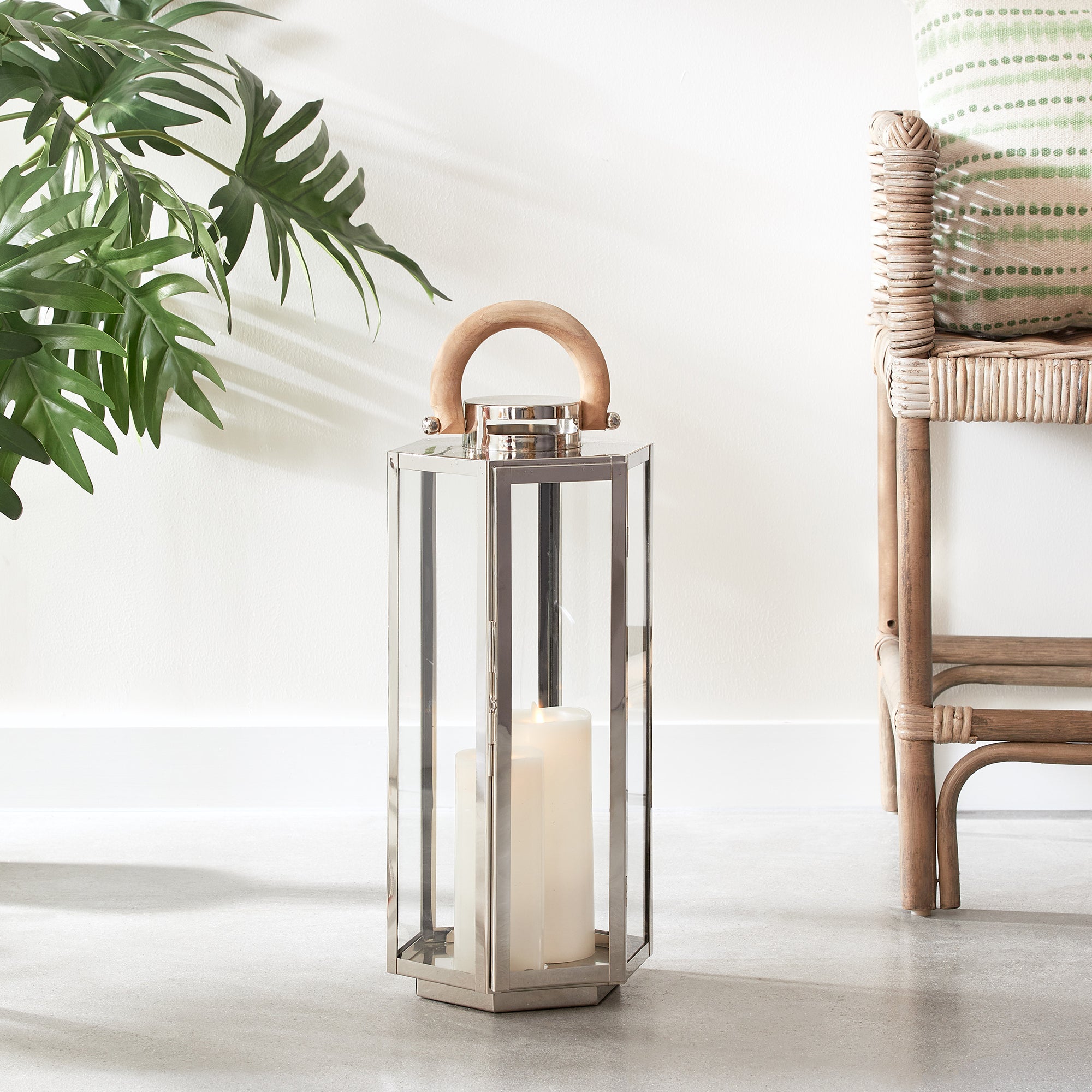 This six panel lantern is made of stainless steel and natural teak handles. Impressive in scale, it is a great accent along the mantle, or on an entry console. Amethyst Home provides interior design, new construction, custom furniture, and area rugs in the Laguna Beach metro area.