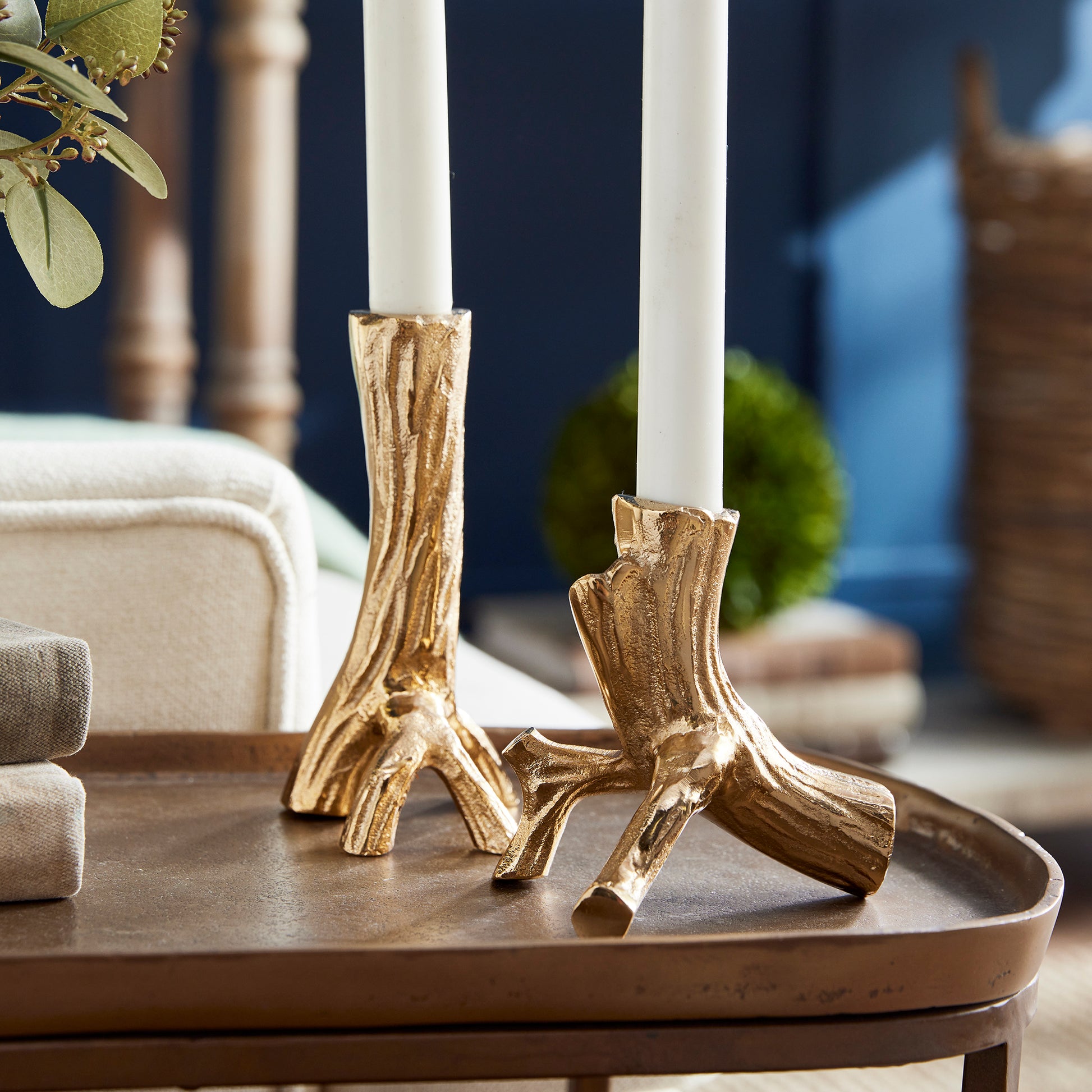 Made from hand-sculpted molds and in solid cast aluminum, these taper holders in warm gold are a substantial accent. Pair with any style taper candle and watch them glow. Amethyst Home provides interior design, new construction, custom furniture, and area rugs in the Omaha metro area.
