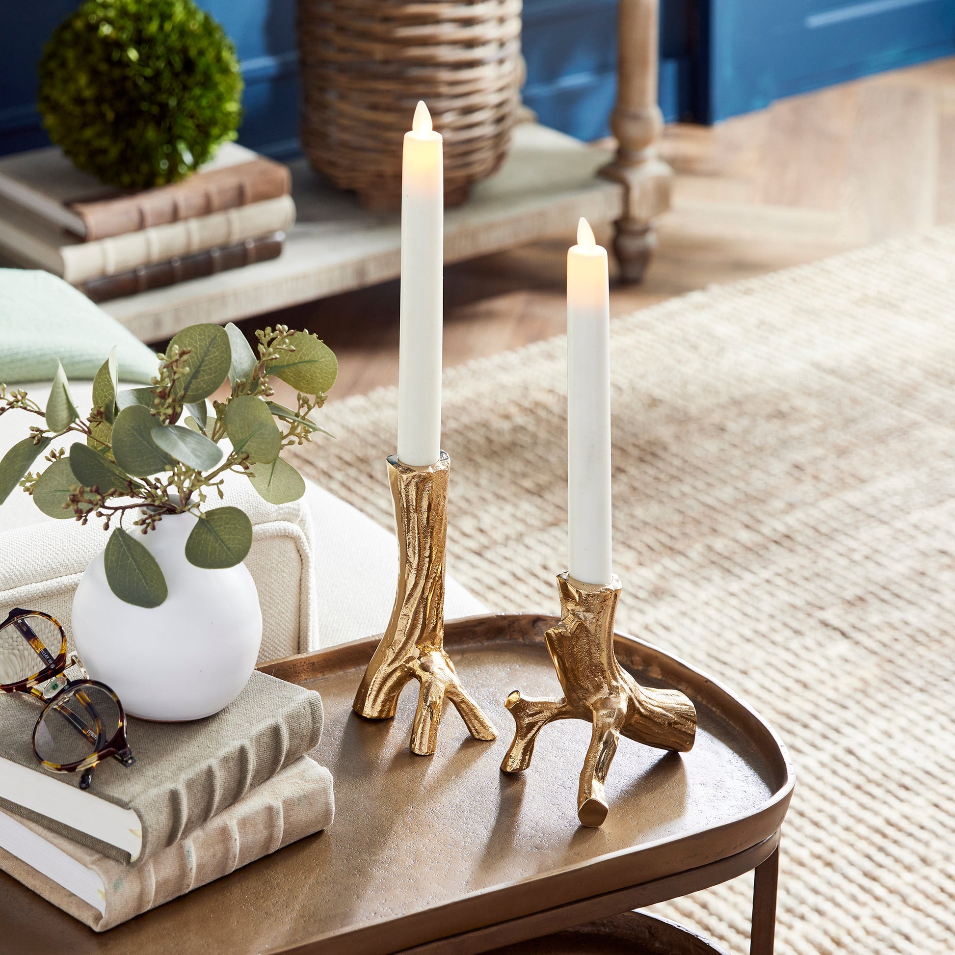 Made from hand-sculpted molds and in solid cast aluminum, these taper holders in warm gold are a substantial accent. Pair with any style taper candle and watch them glow. Amethyst Home provides interior design, new construction, custom furniture, and area rugs in the Seattle metro area.