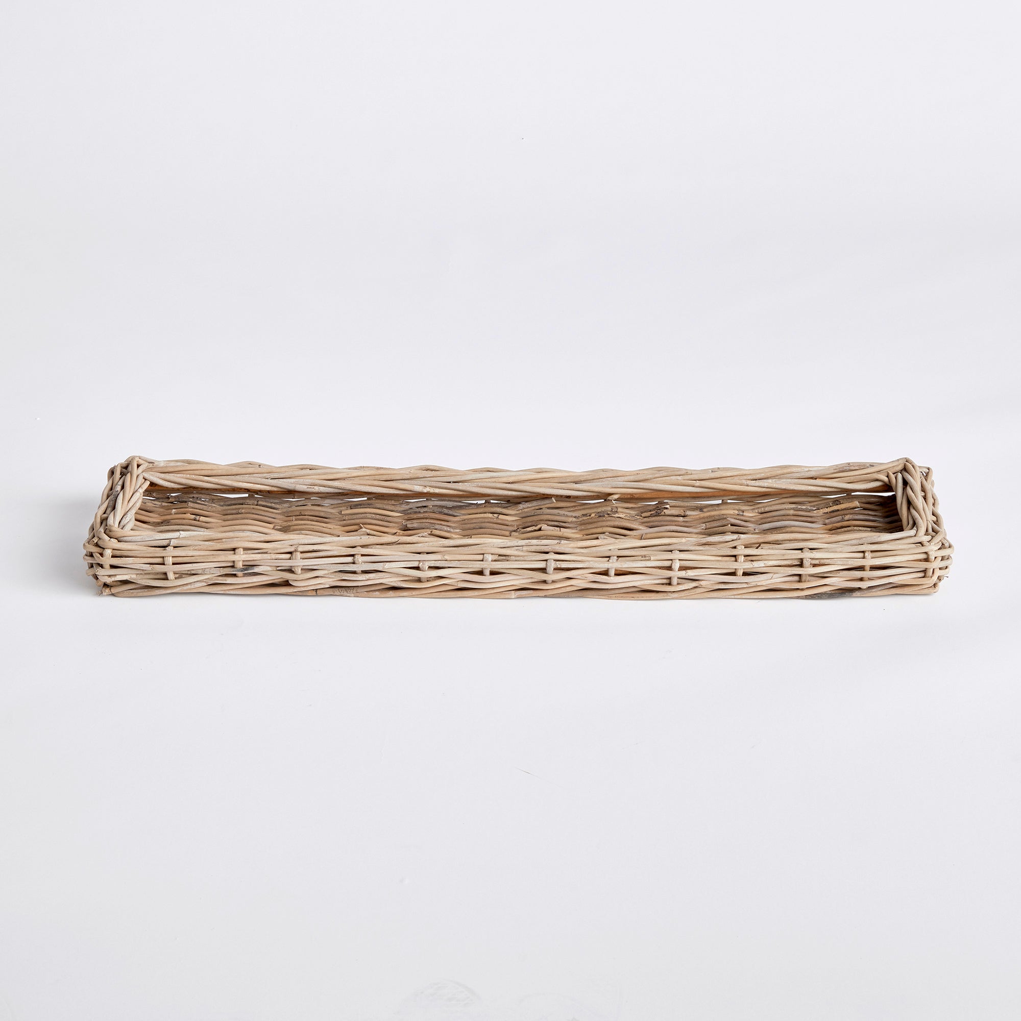 Made of a large gauge rattan, this extra long tray makes a beautiful centerpiece. Fill it with orbs, faux flower stems or leave it just as is for a clean look. Amethyst Home provides interior design, new construction, custom furniture, and area rugs in the Laguna Beach metro area.