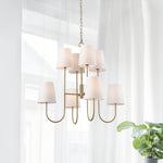 The Kinley Chandelier is a fresh take on a classic two-tiered shape. Subtle modern touches like the tapered shade and gold finish complete the look. Amethyst Home provides interior design, new construction, custom furniture, and area rugs in the Scottsdale metro area.