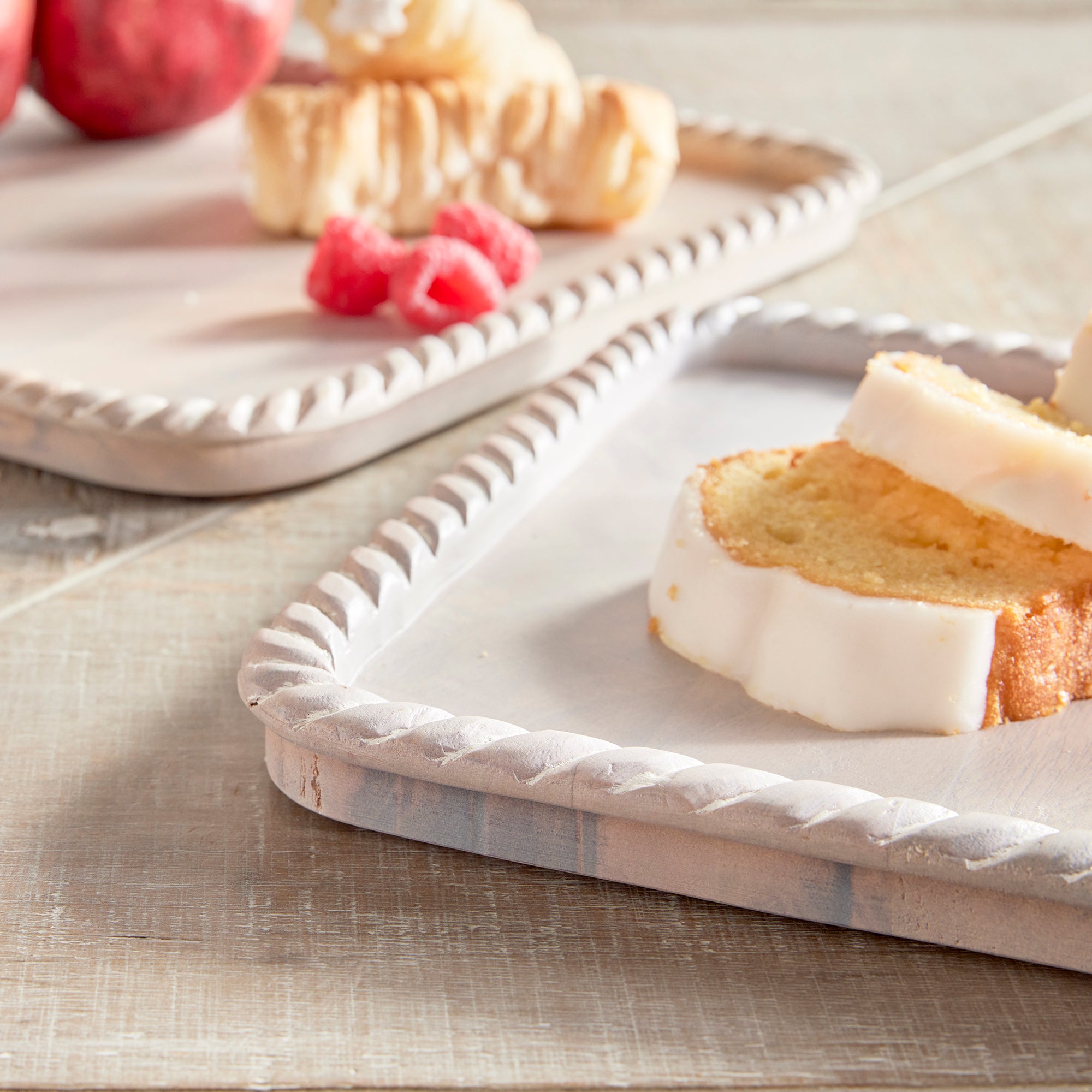 Hand carved from mango wood, this pair of trays is a sweet little accent for baked goods or a cheese tray. A little touch of natural wood tone is always on trend. Amethyst Home provides interior design, new construction, custom furniture, and area rugs in the Des Moines metro area.