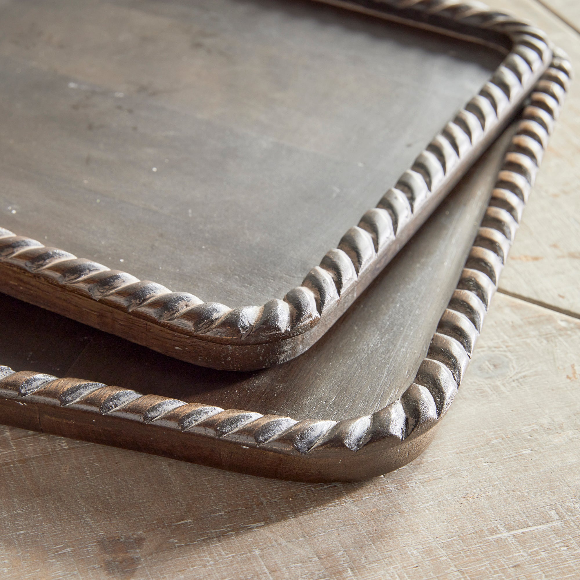 Hand carved from mango wood, this pair of trays is a sweet little accent for baked goods or a cheese tray. A little touch of natural wood tone is always on trend. Amethyst Home provides interior design, new construction, custom furniture, and area rugs in the Los Angeles metro area.