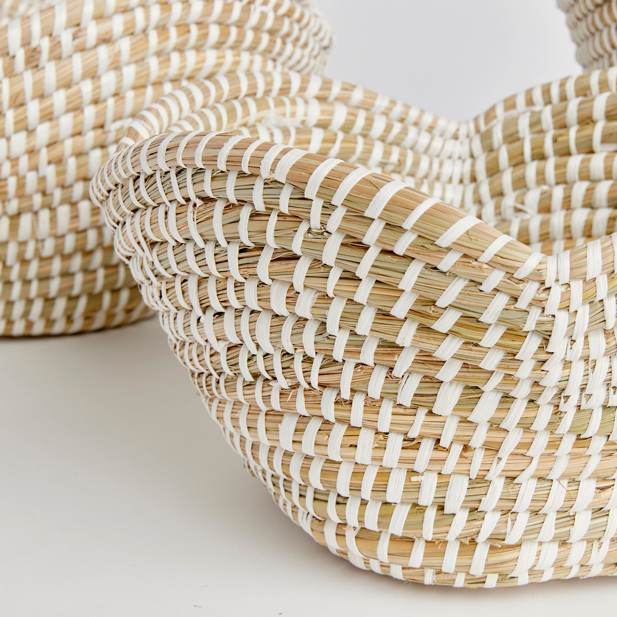 These well-scaled all natural baskets are hand-woven by skilled artisans using sustainable materials. With sculpted petal-like rims, they are just perfect for creating that spa-inspired look for home or office. Amethyst Home provides interior design, new construction, custom furniture, and area rugs in the Boston metro area.