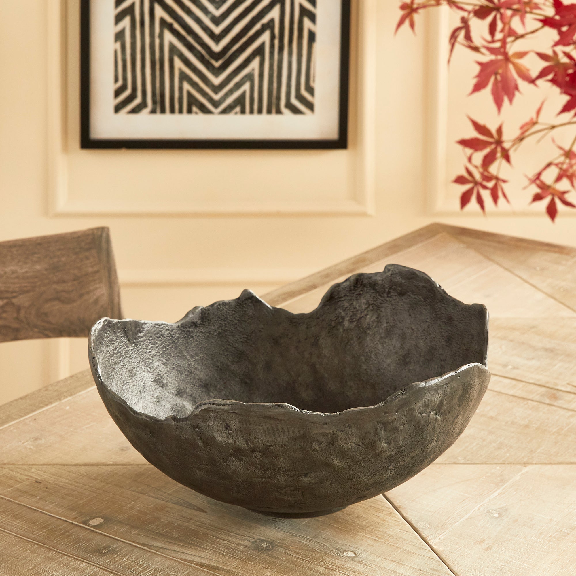 This decorative hand-sculpted bowl is made to be on display. With an oil-rubbed bronze finish and irregular edge, styled or just as it is, a strong statement for the modern space. The epitome of functional art. Amethyst Home provides interior design, new construction, custom furniture, and area rugs in the Omaha metro area.