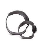 A matte black finish and rough, organic repeated circular shapes make these cast aluminum sculptures unique. A  contemporary touch for home office or den on book shelf, mantle or console. Amethyst Home provides interior design, new construction, custom furniture, and area rugs in the Laguna Beach metro area.