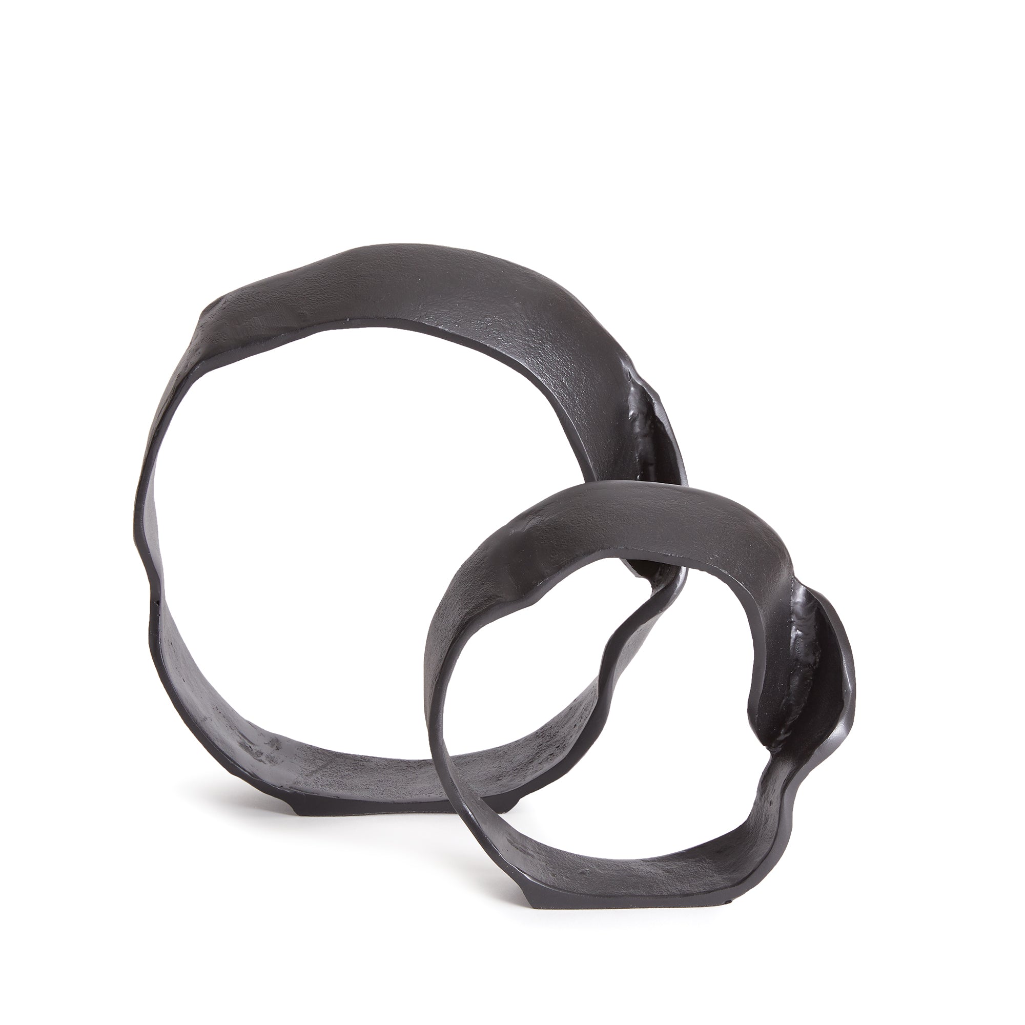 A matte black finish and rough, organic repeated circular shapes make these cast aluminum sculptures unique. A  contemporary touch for home office or den on book shelf, mantle or console. Amethyst Home provides interior design, new construction, custom furniture, and area rugs in the Laguna Beach metro area.