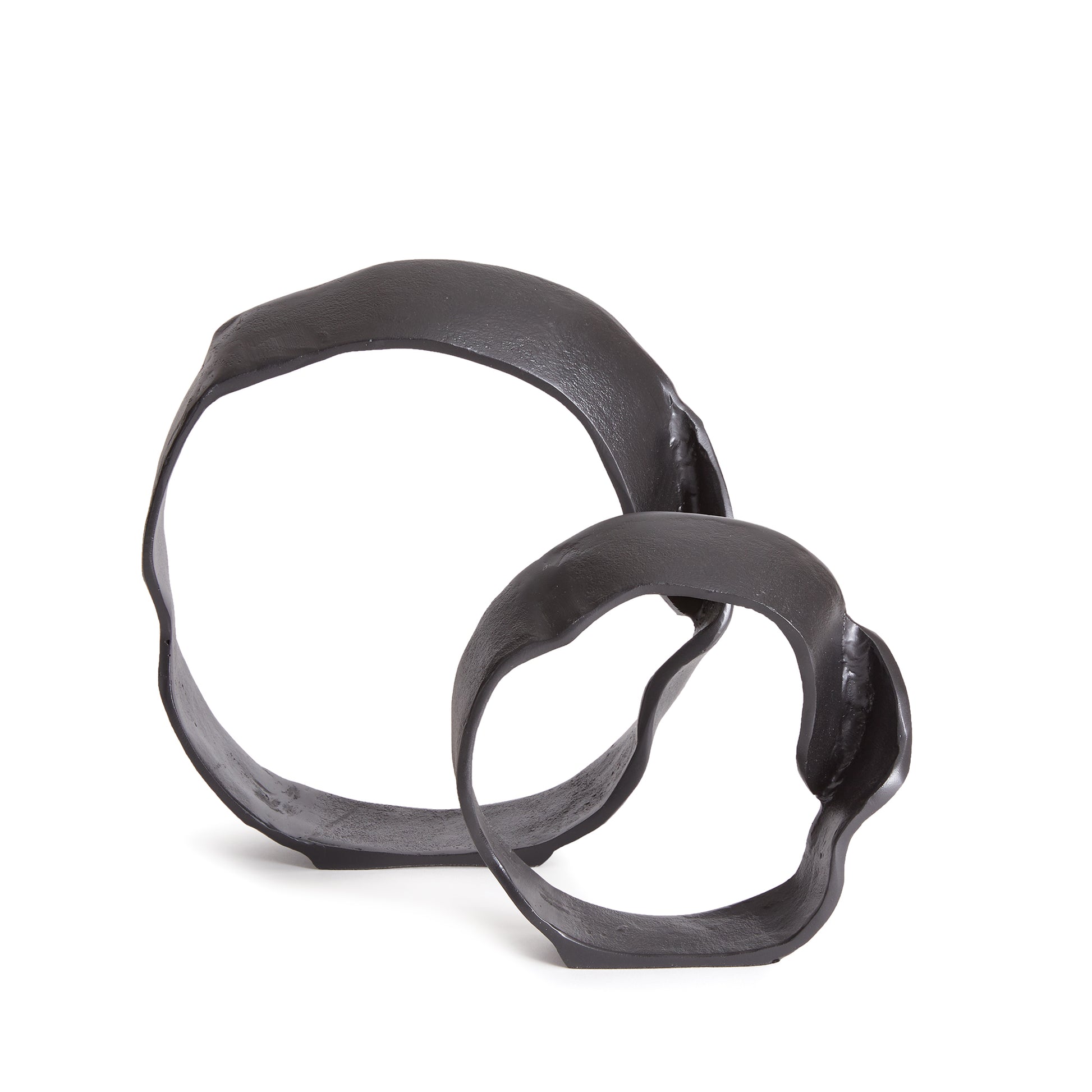 A matte black finish and rough, organic repeated circular shapes make these cast aluminum sculptures unique. A  contemporary touch for home office or den on book shelf, mantle or console. Amethyst Home provides interior design, new construction, custom furniture, and area rugs in the Laguna Beach metro area.
