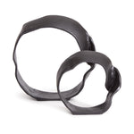 A matte black finish and rough, organic repeated circular shapes make these cast aluminum sculptures unique. A  contemporary touch for home office or den on book shelf, mantle or console. Amethyst Home provides interior design, new construction, custom furniture, and area rugs in the Park City metro area.