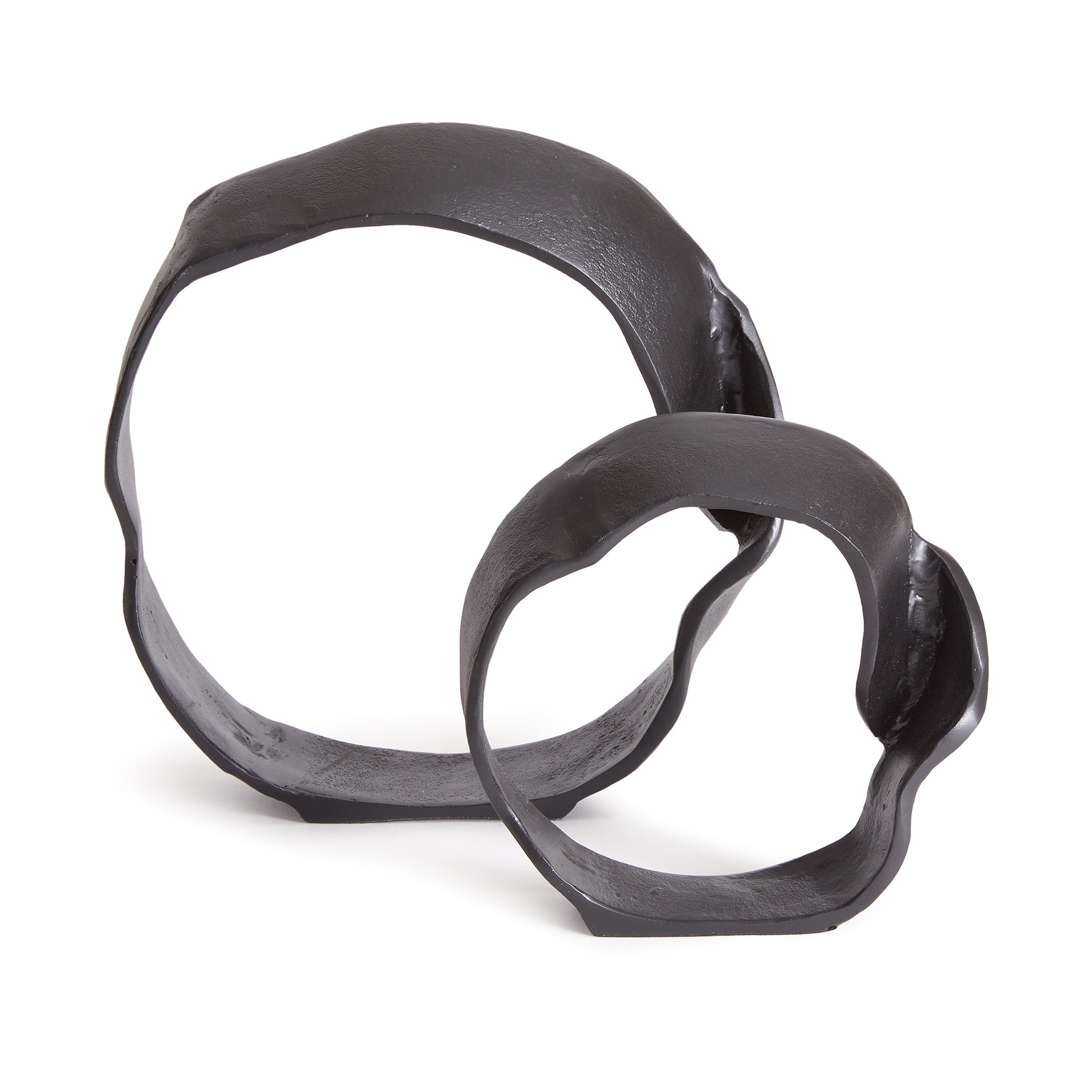 A matte black finish and rough, organic repeated circular shapes make these cast aluminum sculptures unique. A  contemporary touch for home office or den on book shelf, mantle or console. Amethyst Home provides interior design, new construction, custom furniture, and area rugs in the Park City metro area.