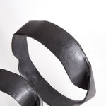A matte black finish and rough, organic repeated circular shapes make these cast aluminum sculptures unique. A  contemporary touch for home office or den on book shelf, mantle or console. Amethyst Home provides interior design, new construction, custom furniture, and area rugs in the Portland metro area.