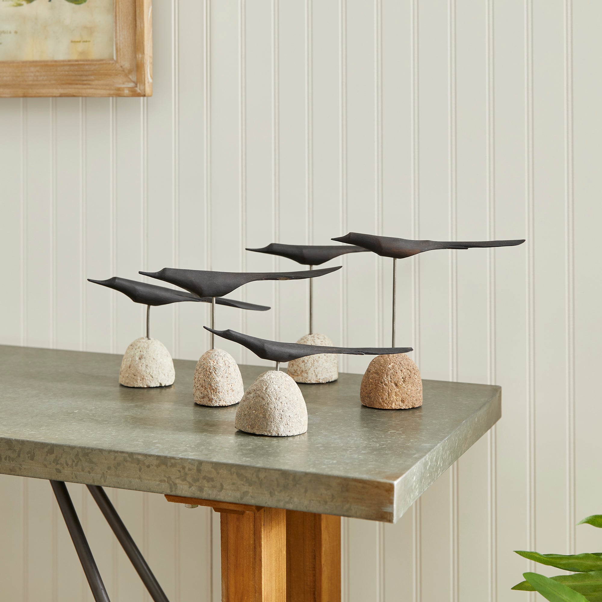 Handcrafted rustic artwork with modern black birds. Amethyst Home provides interior design, new construction, custom furniture, and area rugs in the Houston metro area.