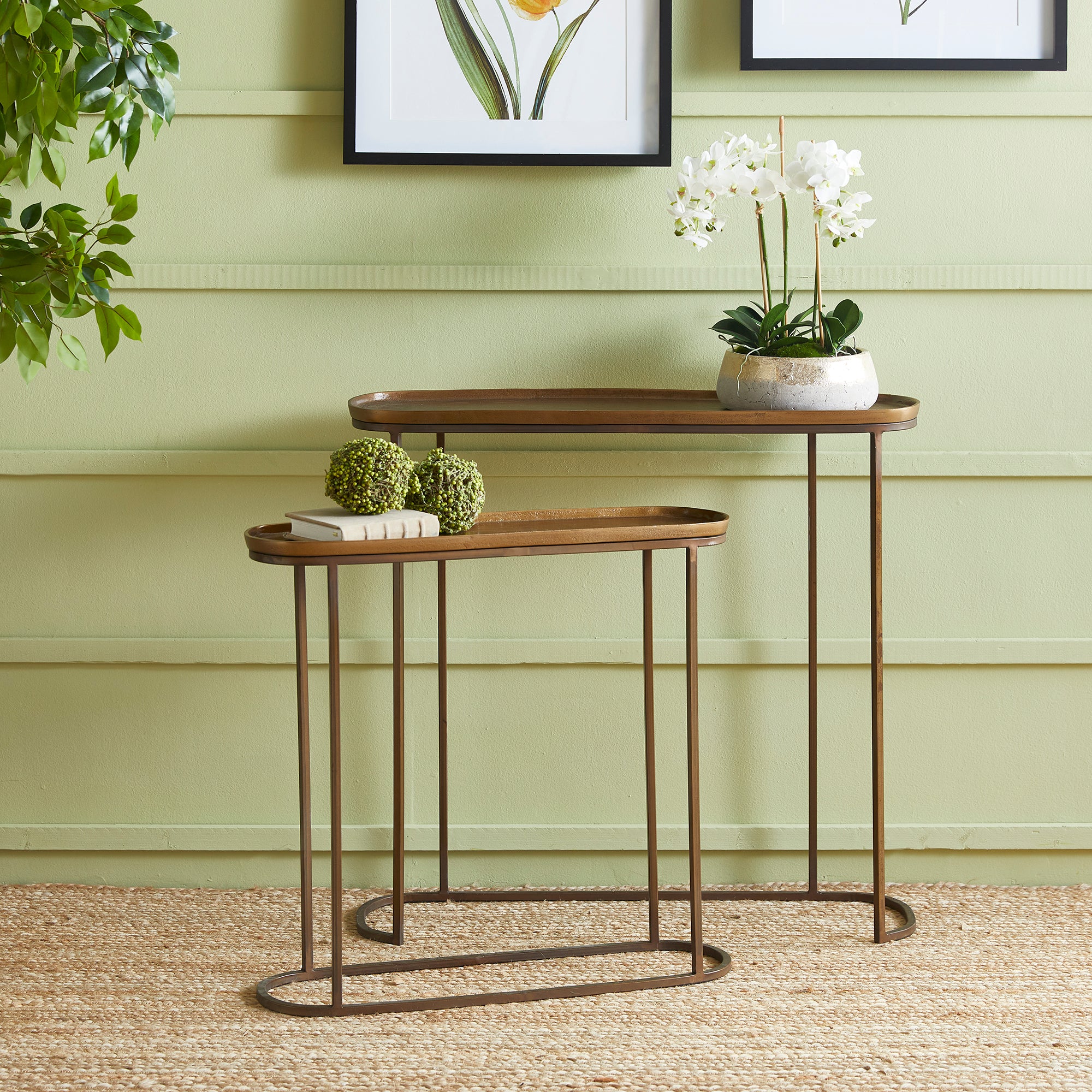 Nested console… what a concept! In an electroplated cast aluminum top and  iron legs, these two pieces fit together nicely, or can be separated to accommodate your layout. Innovative and beautiful, indeed. Amethyst Home provides interior design, new construction, custom furniture, and area rugs in the Tampa metro area.