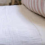 The Harbour White Matelasse Collection features an abstract, geometric weave making it a modern matelasse. The matelasse achieves a beautiful texture without any batting. Amethyst Home provides interior design services, furniture, rugs, and lighting in the Des Moines metro area.