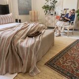 The Montecito Blanket is a 100% heavy weight hand loomed linen that features broad coastal inspired stripes surrounded by a 1/2” finished flange.  Amethyst Home provides interior design services, furniture, rugs, and lighting in the Omaha metro area.