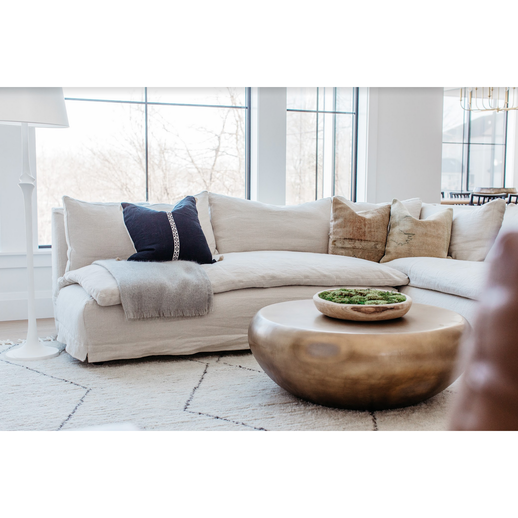 A casual, slipcovered chunky linen sectional by Cisco Brothers, the Laguna 2pc Sectional is the ultimate in casual luxury.A down-filled seat cushion is supported by springs in a gentle, resting position.  Pair with a one-of-a-kind statement rug for a signature look. Shown in Otis White 100% linen. Amethyst Home provides interior design, new home construction design consulting, vintage area rugs, and lighting in the Scottsdale metro area.