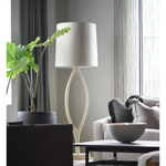 The Urbino Ash Floor Lamp is crafted from sustainably harvested hardwood by Verellen in North Carolina. The unique shape of the body paired with the oatmeal shade complements any room Amethyst Home provides interior design, new home construction design consulting, vintage area rugs, and lighting in the Salt Lake City metro area.