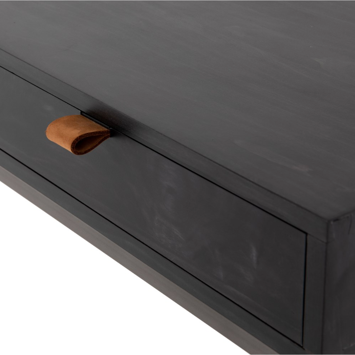 The Trey Black Wash Poplar Modular Writing Desk sleek and simple, black-finished poplar offers plenty of desk storage by way of three spacious drawers. Metal-secured pulls of top-grain leather add a textural element of surprise. Great solo or paired with matching corner desk, file cabinet or credenza.