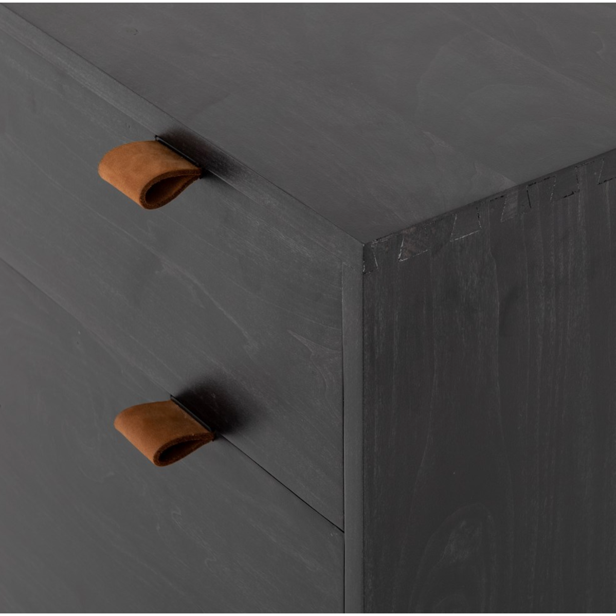 Inspired by clean mid-century design, the Trey Modular Filing Cabinet offers plenty of extra desk storage space. The cabinet is available in two colors, Auburn Poplar and a Black Wash Poplar. Metal-secured leather pulls add a textural element of surprise. Great solo or paired with matching desk or credenza.