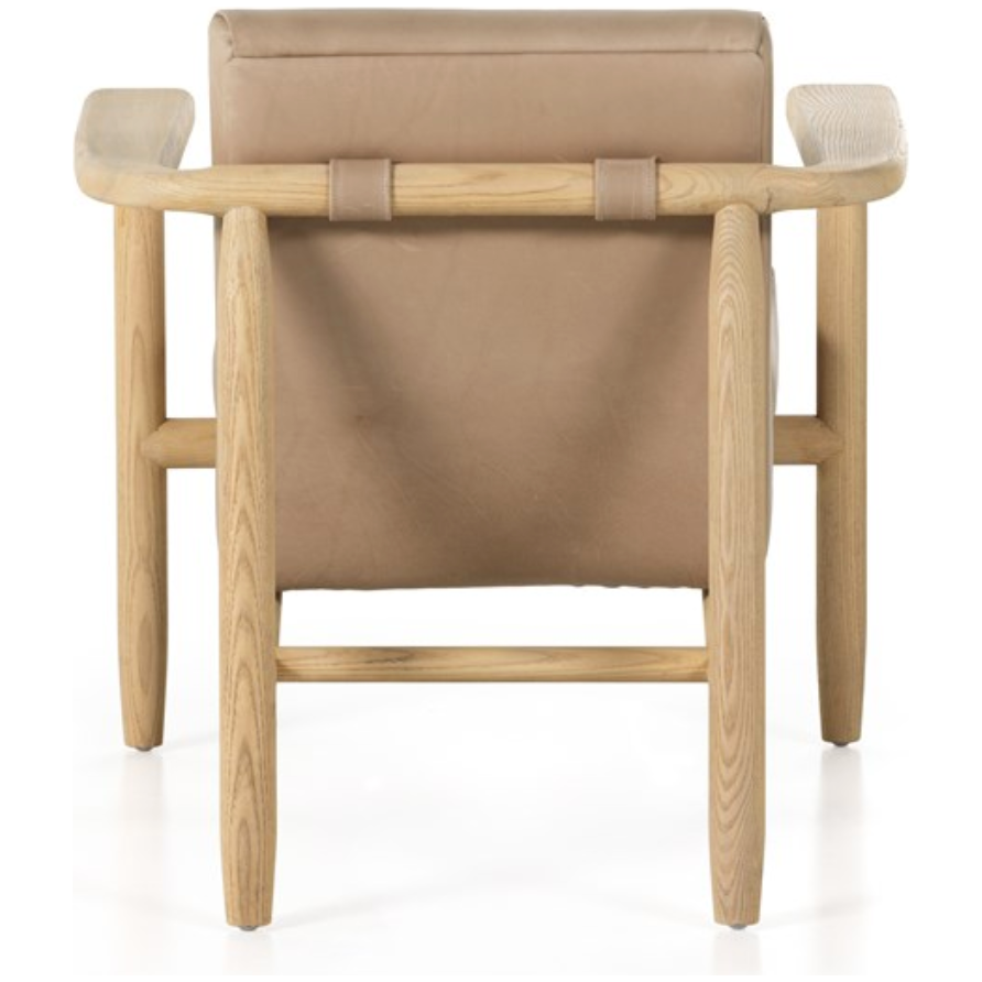 Featuring Arnett Chair by Four Hands at Amethyst Home. Textural cream boucle seating offers a sumptuous sit, with complementary wire-brushed parawood framing forming a slim U shape. Two posterior top-grain leather straps add a stylish finishing touch. Performance fabrics are specially created to withstand spills, stains, high traffic and wear, ensuring long-te. Amethyst Home provides interior design, new home construction design consulting, vintage area rugs, and lighting in the Austin metro area.