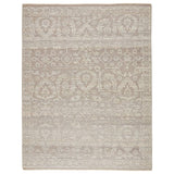 The Sonnette Ayres Area Rug by Jaipur Living, or SNN03, boasts a neutral palette of light taupe and gray that creates beautiful dimension among the brocade design. This hand-knotted wool rug features fringe trimmed details for a touch of global charm. A gorgeous choice for your bedroom or other medium traffic areas. 