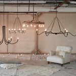 Add unique and modern lighting to a room with this Spider Chandelier from Cisco Brothers. The curved arms add beautiful sight lines to the fixture and plenty of light. This light fixture sets any room apart and comes available in either a "rust" or "flat black" finish in three different sizes.