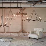 Add unique and modern lighting to a room with this Spider Chandelier from Cisco Brothers. The curved arms add beautiful sight lines to the fixture and plenty of light. This light fixture sets any room apart and comes available in either a "rust" or "flat black" finish in three different sizes.