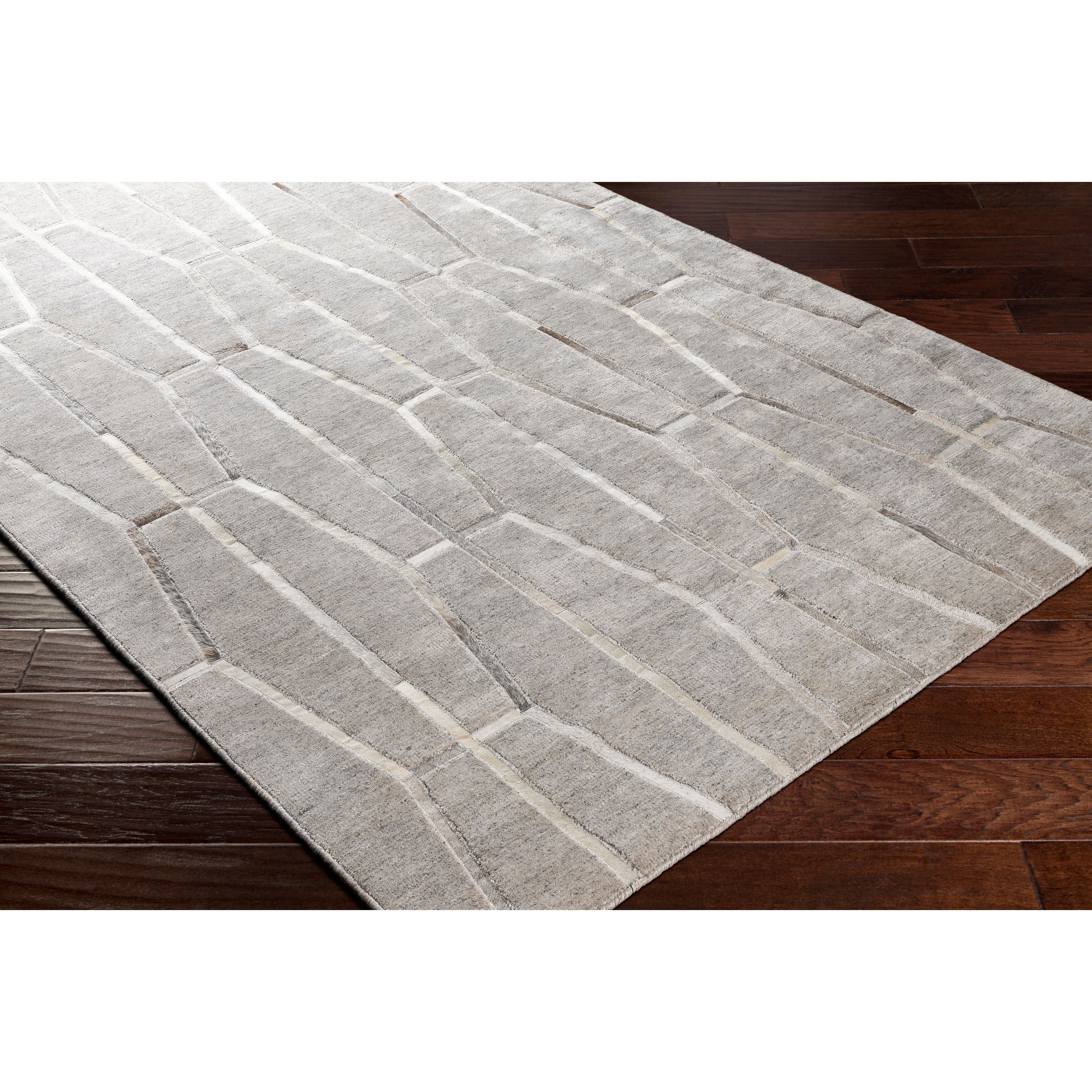 The simplistic yet compelling rugs from the Eloquent Collection effortlessly serve as the exemplar representation of modern decor. These rugs are hand crafted, radiating an atmosphere that can only be created by a handmade rug. Made with Viscose, Leather in India, and has No Pile. Spot Clean Only, One Year Limited Warranty. Amethyst Home provides interior design, new construction, custom furniture, and rugs for Monterey metro area