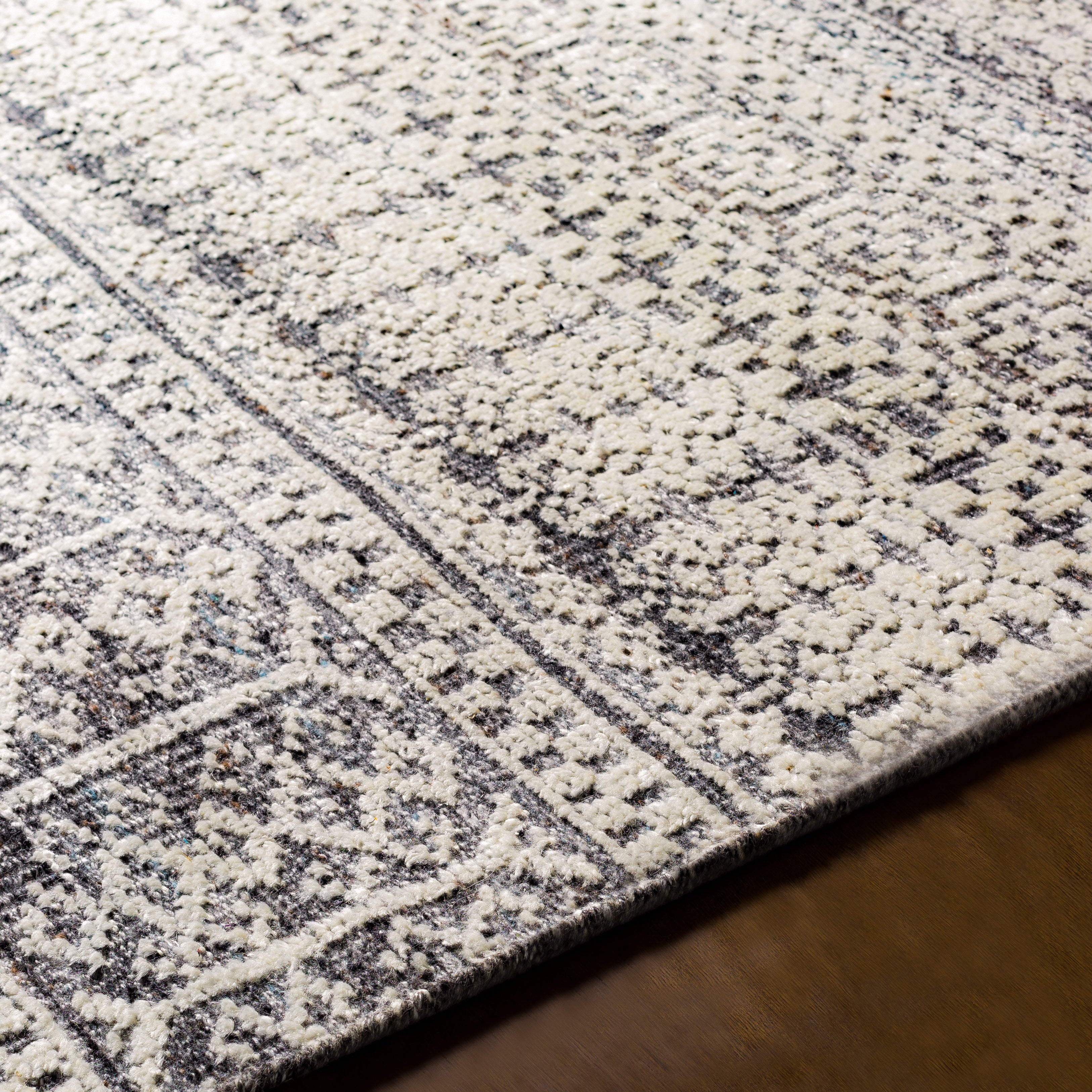 Featuring Nobility Charcoal Hand-Knotted Rug by Surya at Amethyst Home. Add an elegant touch to any space with this hand-knotted Nobility Charcoal Rug. Its blend of wool and viscose is ultra soft and smooth, while its timeless ornate motif with modern lines create an exquisite, timeless piece. Enjoy its high-low characteristics and luxurious feel to add a touch of sophisticati. Amethyst Home provides interior design, new construction, custom furniture, and area rugs in the Laguna Beach metro area.
