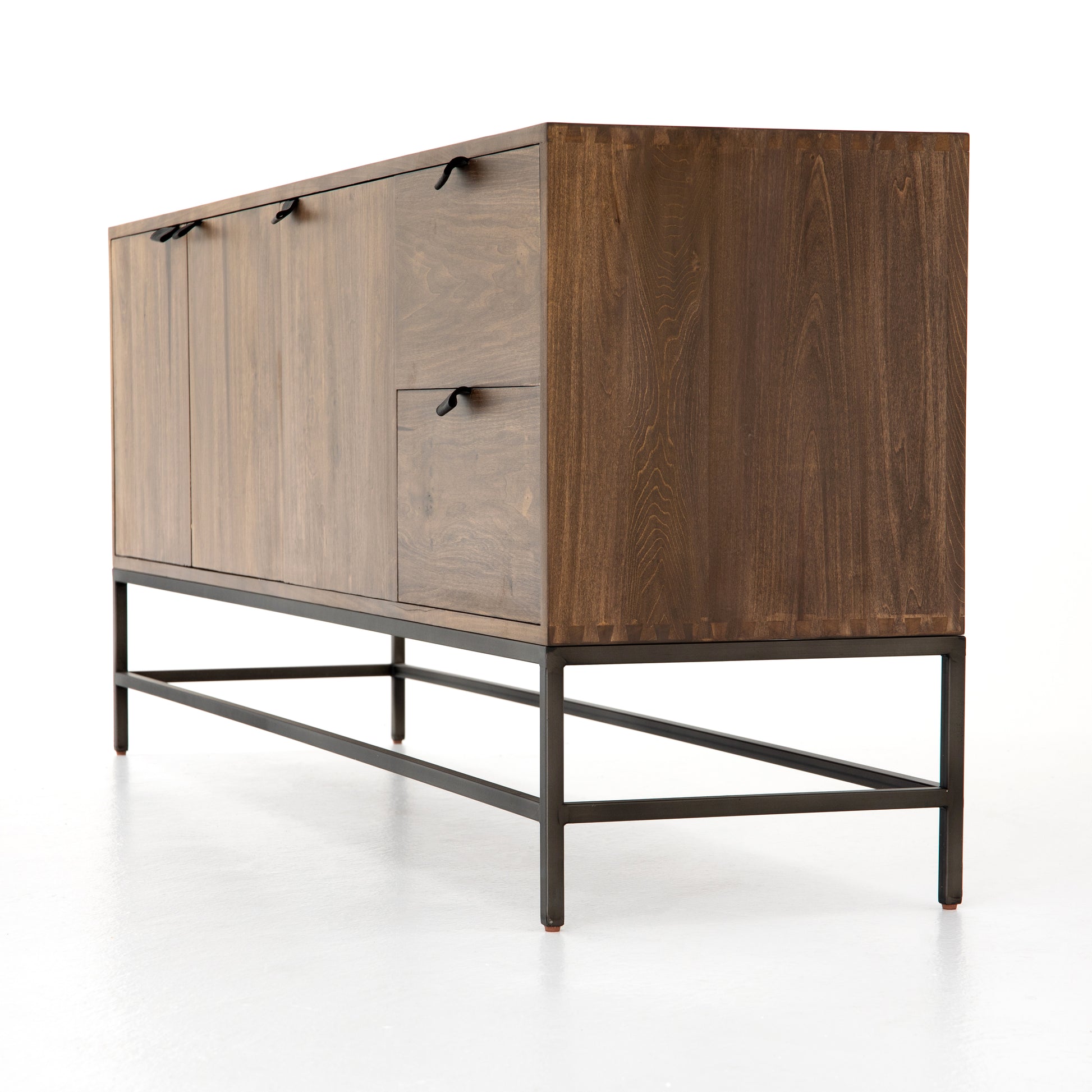 We love the clean, slim legs of this Trey Auburn Poplar Sideboard. The doors and drawers make this the perfect sideboard for families wanting extra storage space while also making a statement  Size: 72"w x 18"d x 31"h Materials: Iron, Poplar, Top Grain Leather