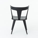 Featuring Ripley Black Dining Chair by Four Hands at Amethyst Home. This new take on the mid-century Windsor chair, the Ripley Dining Chair has a bowed, sculptural silhouette. A soft black finish adds movement to the wood by highlighting the natural grain of weathered oak. The chair is perfect for the chic, modern dining room look or that special nook in y.  Amethyst Home provides interior design, new home construction design consulting, vintage area rugs, and lighting in the Calabasas metro area.