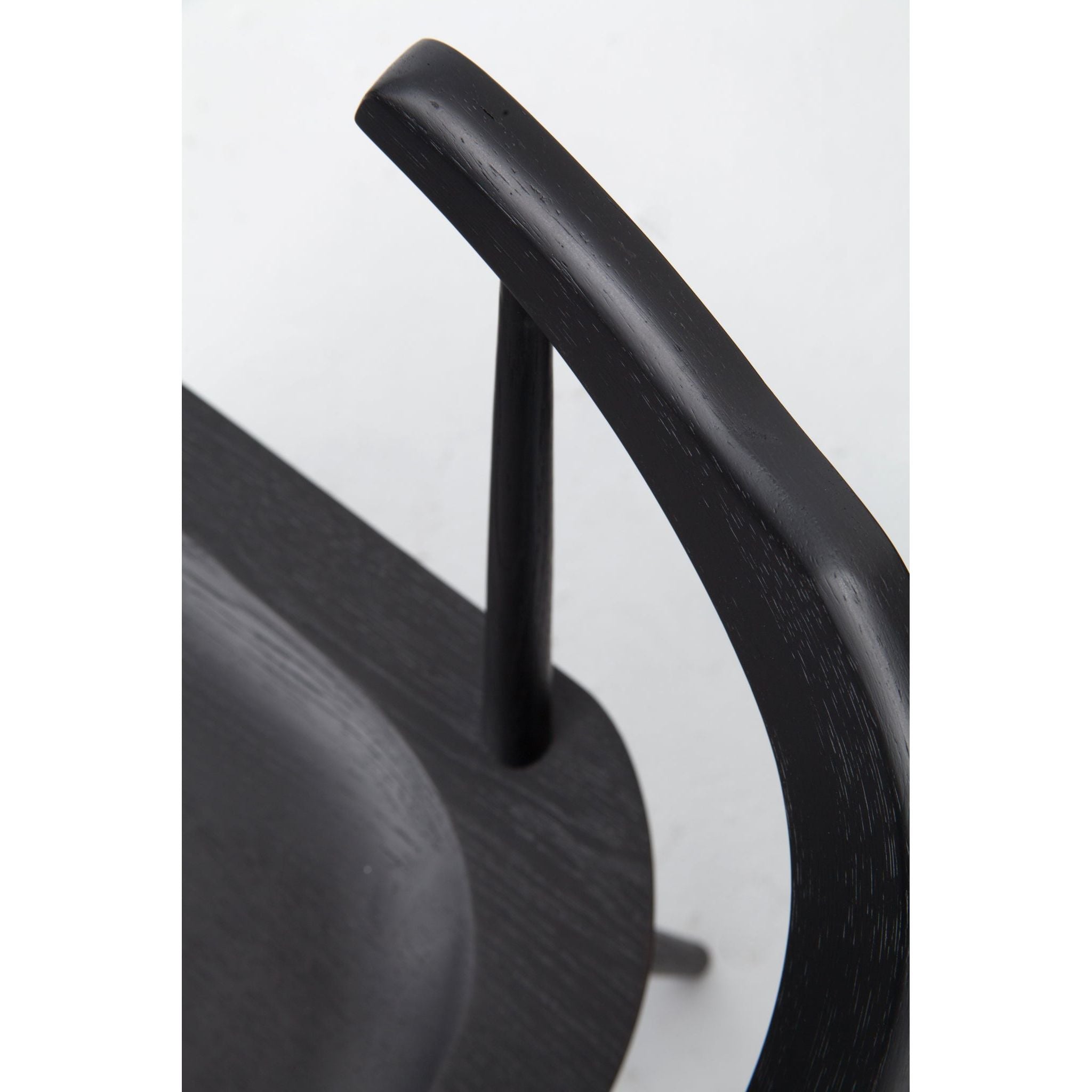 Featuring Ripley Black Dining Chair by Four Hands at Amethyst Home. This new take on the mid-century Windsor chair, the Ripley Dining Chair has a bowed, sculptural silhouette. A soft black finish adds movement to the wood by highlighting the natural grain of weathered oak. The chair is perfect for the chic, modern dining room look or that special nook in you.  Amethyst Home provides interior design, new home construction design consulting, vintage area rugs, and lighting in the Seattle metro area.