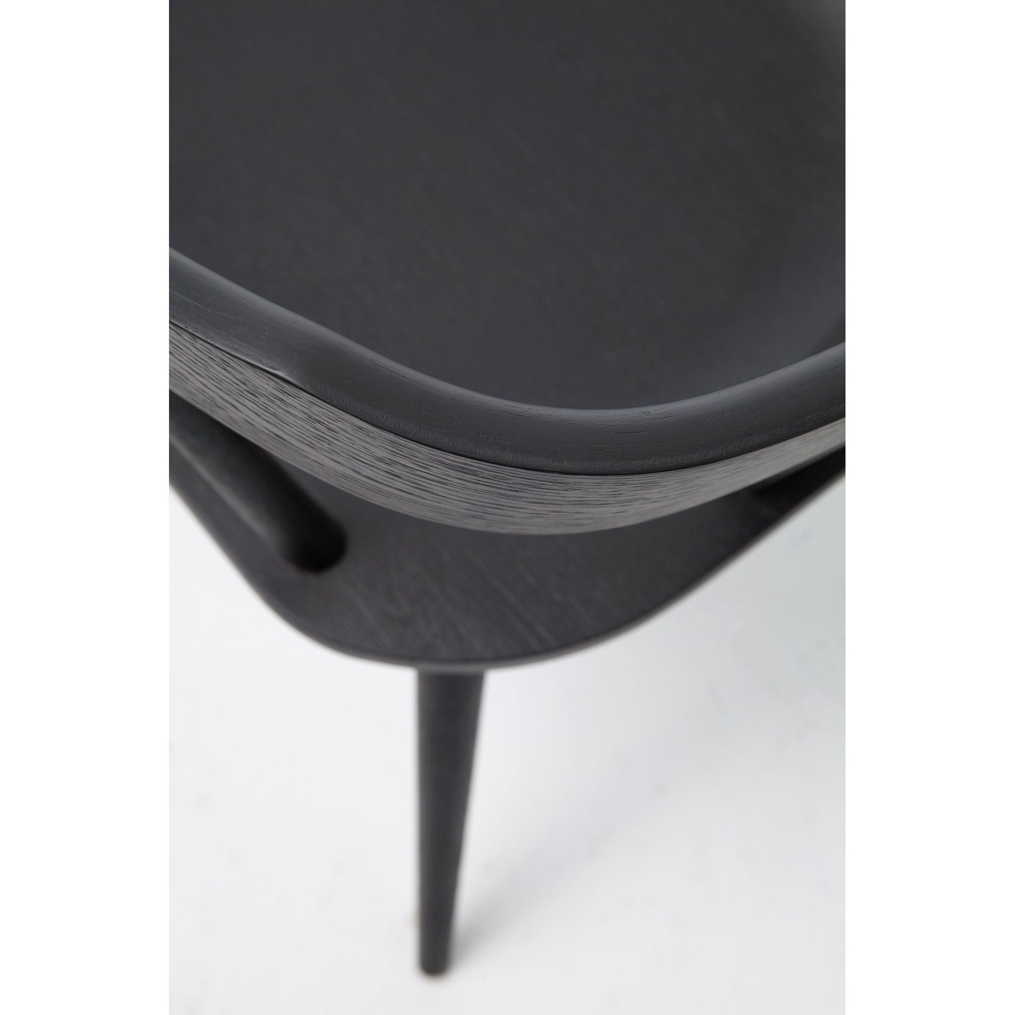 Featuring Ripley Black Dining Chair by Four Hands at Amethyst Home. This new take on the mid-century Windsor chair, the Ripley Dining Chair has a bowed, sculptural silhouette. A soft black finish adds movement to the wood by highlighting the natural grain of weathered oak. The chair is perfect for the chic, modern dining room look or that special nook in y.  Amethyst Home provides interior design, new home construction design consulting, vintage area rugs, and lighting in the Park City metro area.