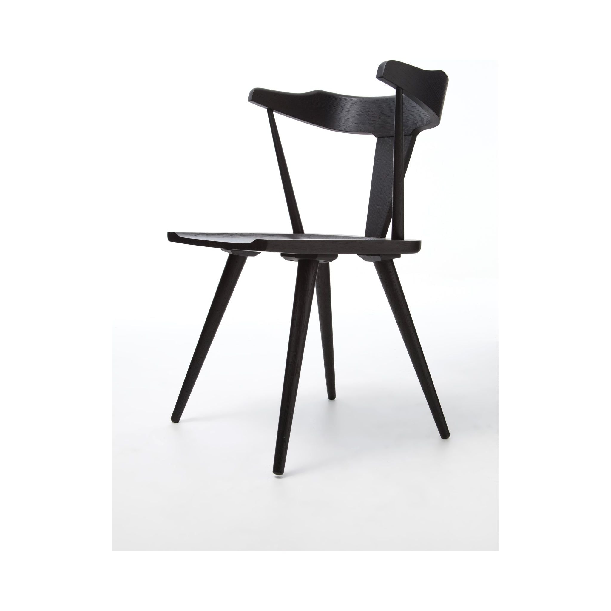Featuring Ripley Black Dining Chair by Four Hands at Amethyst Home. This new take on the mid-century Windsor chair, the Ripley Dining Chair has a bowed, sculptural silhouette. A soft black finish adds movement to the wood by highlighting the natural grain of weathered oak. The chair is perfect for the chic, modern dining room look or that special nook in y.  Amethyst Home provides interior design, new home construction design consulting, vintage area rugs, and lighting in the Park City metro area.