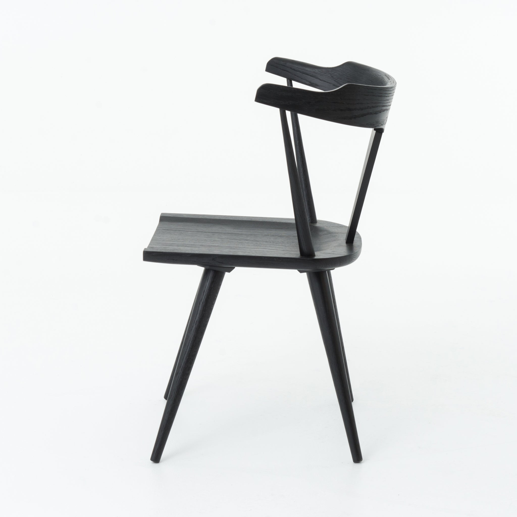 Featuring Ripley Black Dining Chair by Four Hands at Amethyst Home. This new take on the mid-century Windsor chair, the Ripley Dining Chair has a bowed, sculptural silhouette. A soft black finish adds movement to the wood by highlighting the natural grain of weathered oak. The chair is perfect for the chic, modern dining room look or that special nook in your .  Amethyst Home provides interior design, new home construction design consulting, vintage area rugs, and lighting in the Omaha metro area.