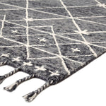 Featuring Vera Rhea Hand-Knotted Rug by Jaipur Living at Amethyst Home. Hand-tufted of wool, the Vera collection by Nikki Chu infuses contemporary spaces with inspiring patterns and versatile colorways. The glam-meets-global Rhea rug features an ivory Moroccan-inspired trellis design that covers the gray and black backdrop with a space-dyed effect. Lon.  Amethyst Home provides interior design, new home construction design consulting, vintage area rugs, and lighting in the Winter Garden metro area.