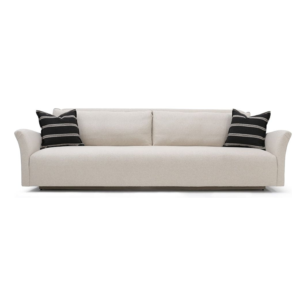 The Charlotte Sofa Family is a classic piece that gains elegance and relevance with a new minimal base. Made with a sustainably harvested hardwood frame, it comes standard with:  • upholstered and slipcovered • tight seat configuration • loose back configuration • 2″ H recessed wood base • knife edge toss