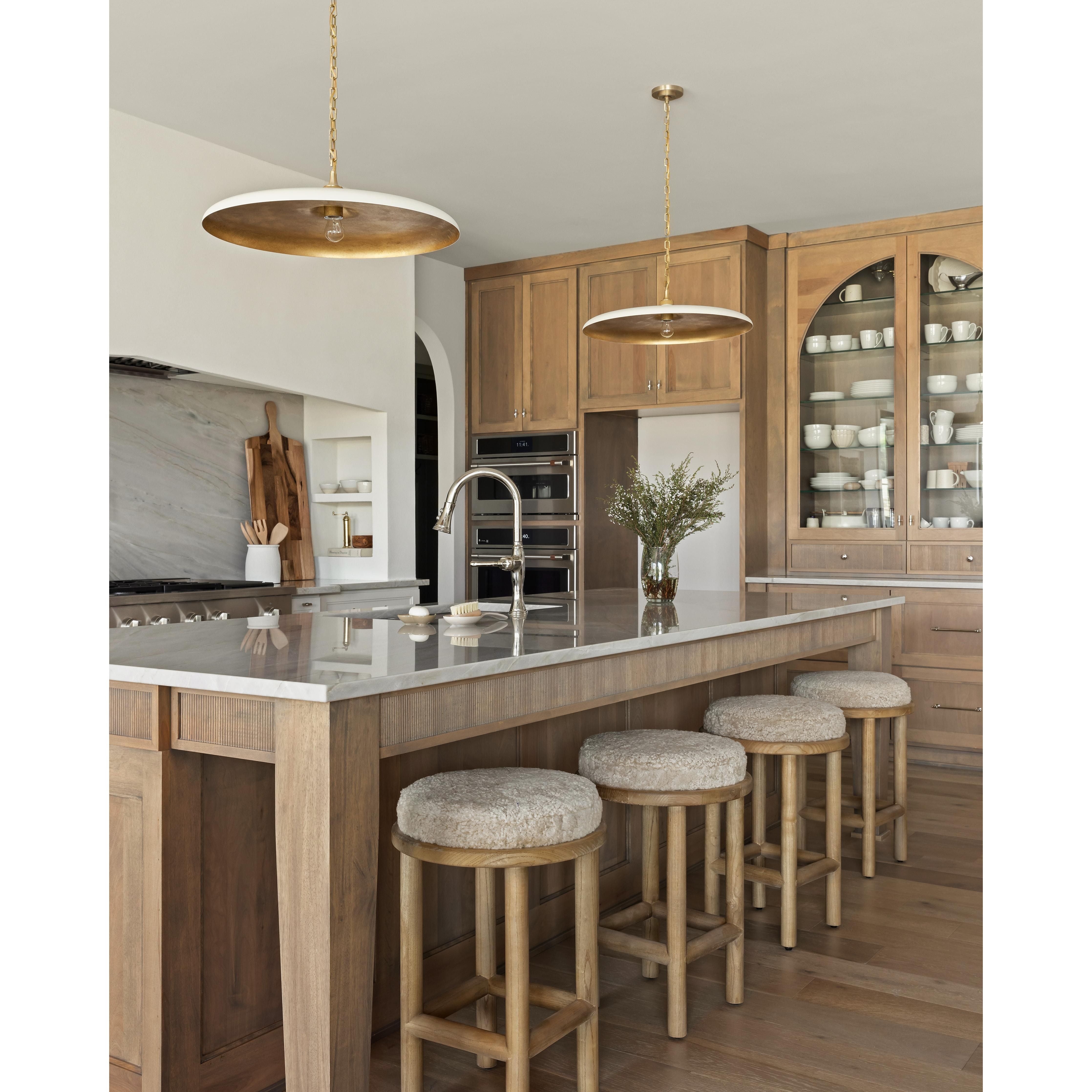 Featuring Piatto Large Pendant by Visual Comfort at Amethyst Home. The Piatto Large Pendant is one of our favorite lighting pieces for a kitchen island. Finished in a Hand-Rubbed Antique Brass with Plaster White Shade is an elegant take on a timeless pendant light.
Overall Dimensions: 24" L x 24" W x 7" HWeight: 9 lbs..  Amethyst Home provides interior design, new home construction design consulting, vintage area rugs, and lighting in the Nashville metro area.