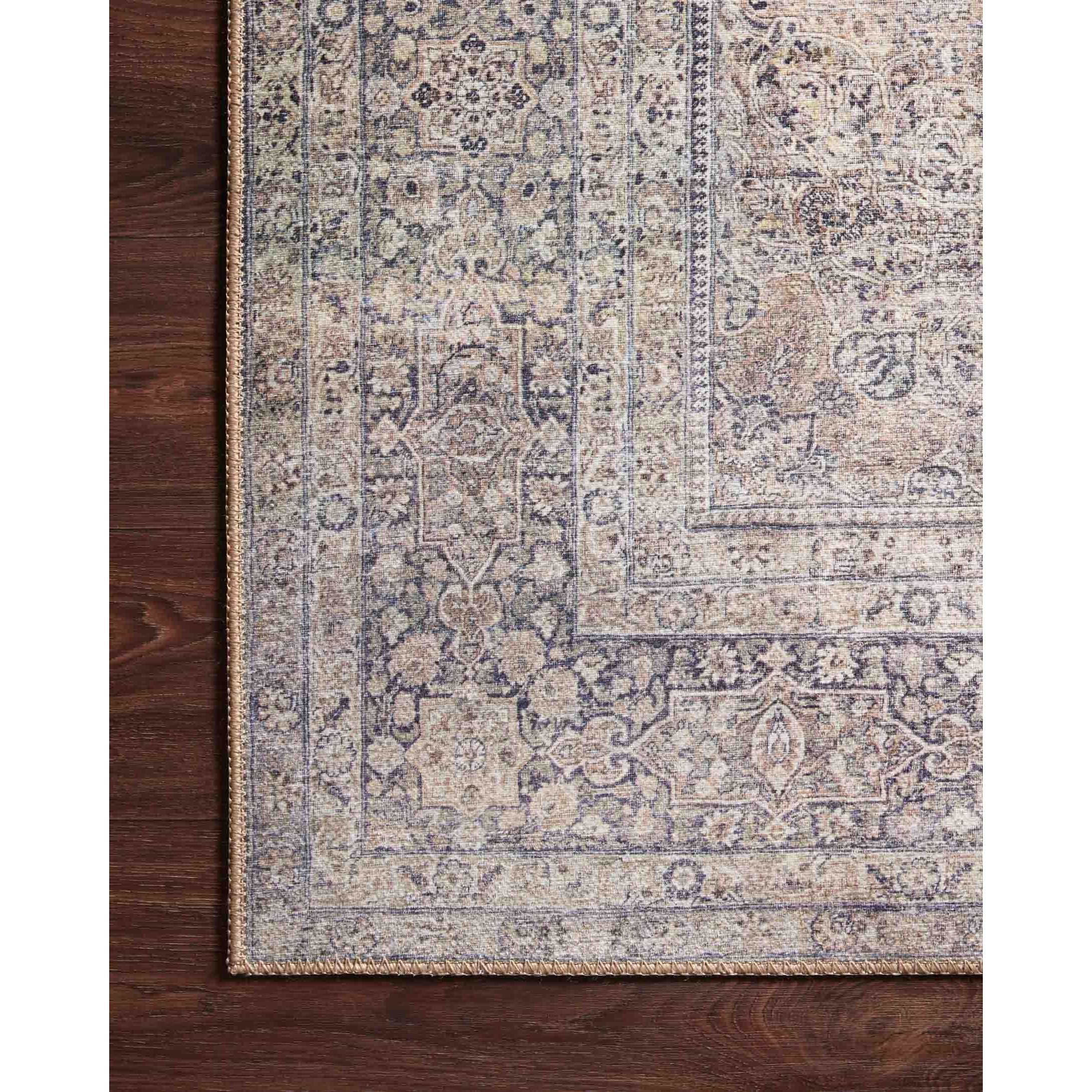 Featuring Wynter Silver / Charcoal Rug by Loloi at Amethyst Home. Old soul, new spirit. Power-loomed of 100% polyester, the Wynter Silver / Charcoal area rug showcases a one-of-a-kind vintage or antique area rug look at an affordable price. This rug brings in tones of silver, gray, blue, tan, and hints of green and ideal for high traffic areas due to the rug.  Amethyst Home provides interior design, new home construction design consulting, vintage area rugs, and lighting in the Seattle metro area.
