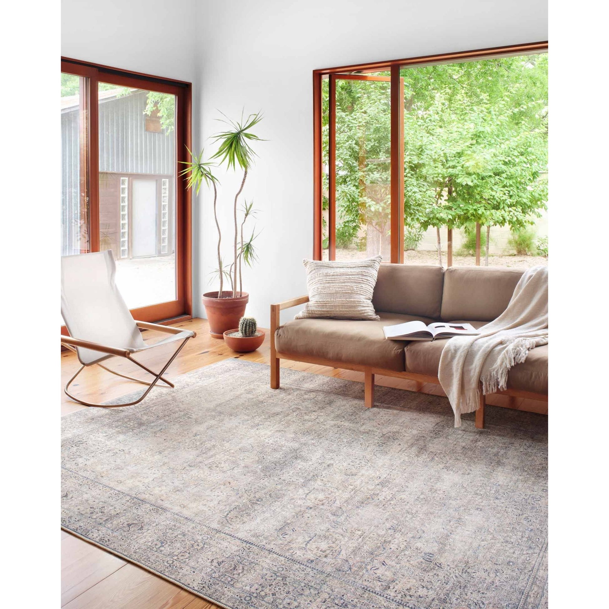 The Wynter Silver / Charcoal area rug showcases a one-of-a-kind vintage or antique area rug look power-loomed of 100% polyester. This rug brings in tones of silver, gray, blue, tan, and hints of green. The rug is ideal for high traffic areas such as living rooms, dining rooms, kitchens, hallway, and entryways.