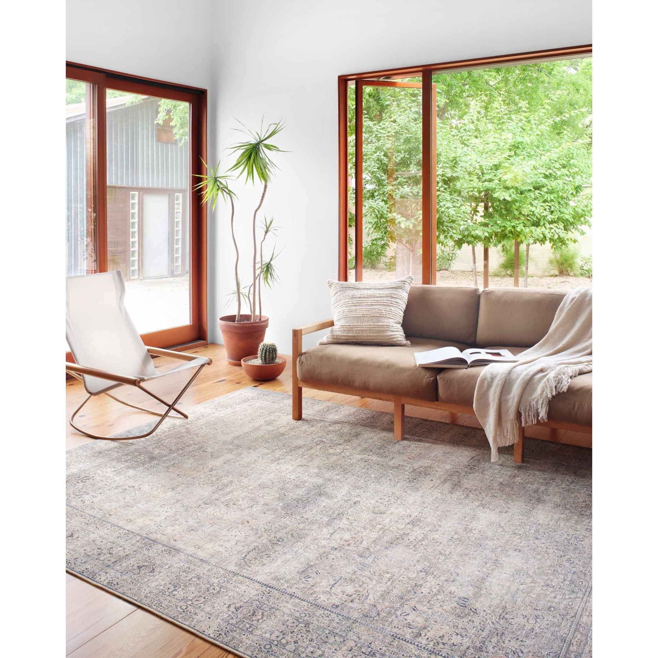 The Wynter Silver / Charcoal area rug showcases a one-of-a-kind vintage or antique area rug look power-loomed of 100% polyester. This rug brings in tones of silver, gray, blue, tan, and hints of green. The rug is ideal for high traffic areas such as living rooms, dining rooms, kitchens, hallway, and entryways.