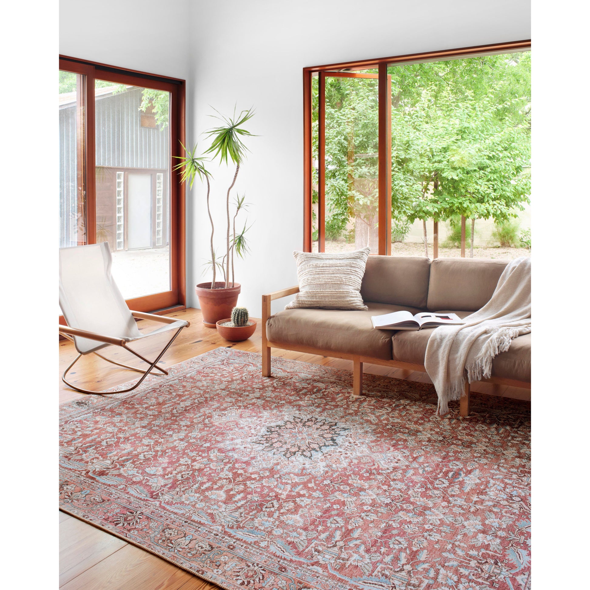 The Wynter Tomato / Teal area rug showcases a one-of-a-kind vintage or antique area rug look power-loomed of 100% polyester. This rug brings in tones of red, orange, blue, and ivory. The rug is ideal for high traffic areas due to the rug's durability for living rooms, dining rooms, kitchens, hallways, and entryways.