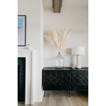 The Harten cabinet is beautifully crafted of black stained pine.  Its versatile cabinet drawer combo is perfect for both media and dining room storage.  Size: 63"l x 20"d x 31"h  Finish may vary slightly by piece as this is a hand-crafted product.  Please allow 3-5 weeks for shipping.