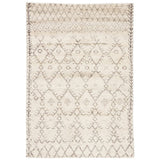Featuring Zuri Turtledove/Walnut Hand-Knotted Rug by Jaipur Living at Amethyst Home. Soft and luxurious in feel, the Zuri Turtledove/Walnut area rug by Jaipur Living is a modern take on a classic Moroccan area rug. The supple hand-knotted, 100% wool showcased in natural tones of ivory and brown with distressed patterns reminiscent of tile motifs.
Zuri represen.  Amethyst Home provides interior design, new home construction design consulting, vintage area rugs, and lighting in the Omaha metro area.