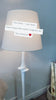 We love the detail in the middle of this Bates Large Sculpted Floor Lamp by Visual Comfort. The linen shade brings a soft, warm glow to any living room, bedroom, or other area needing extra light.  Designer: Chapman & Myers