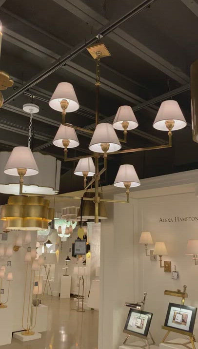 The gorgeous layers of linen shades on this Jane Large Offset Chandelier by Visual Comfort make it a classic, elegant piece to add to any living room, dining room, or other large area.   Designer: Alexa Hampton