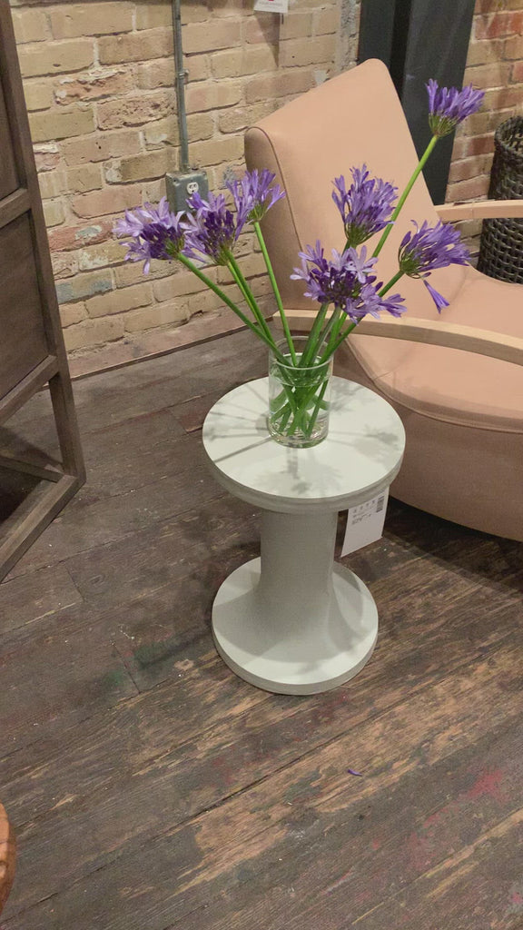 Made from white-finished cast aluminum with high texture, this dramatically tapered Gino End Table - Matte White makes for a stylish spot to keep a favorite book or drink within reach. Tabletop surfaces may vary in texture and dimples, reflective of materials' organic roots.  Overall Dimensions: 13.00"w x 13.00"d x 20.00"h