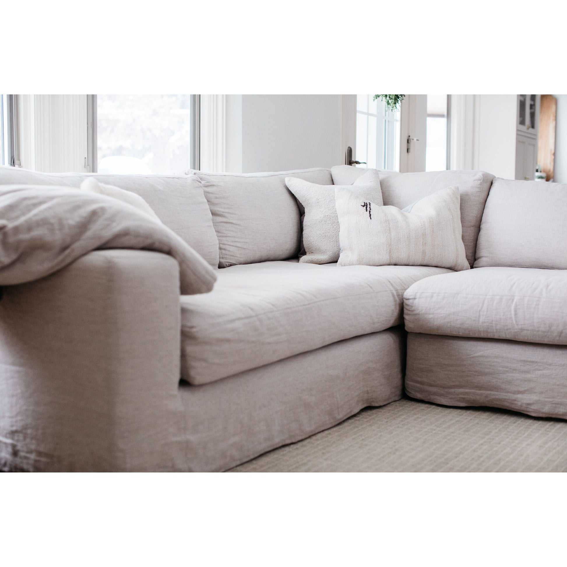 With its streamlined silhouette and strong, angular lines the Loft 2 Arm Sectional by Cisco Brothers is classic without being too traditional. It has a modern essence and elegance that lends inviting appeal to your living room. Dim the lights, and settle down with the family for an entertaining night in. Photographed in Naoki Hemp (discountinued). Shown as a Left Arm Facing Sectional.   Overall: 96"w x 130"d x 29"h