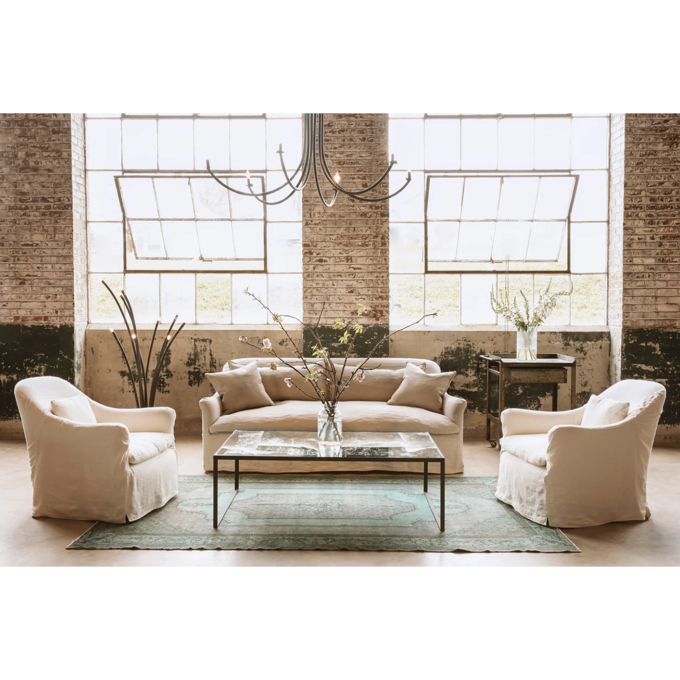 Add unique and modern lighting to a room with this Ramo Chandelier from Cisco Brothers. The curved arms add beautiful sight lines to the fixture and plenty of light.  Overall: 60”dia. 30.5"h Chain Length: 3' Canopy: 6"dia